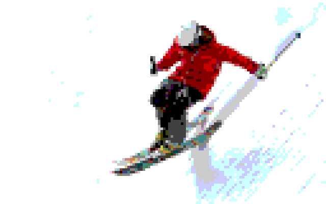 スキーで雪山を下る男性